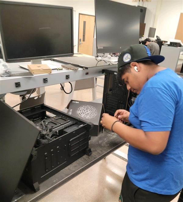 Student working on machine CHS